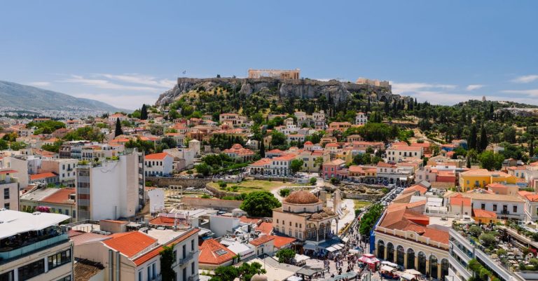 Scenic aerial view of Athens, Greece, showcasing the Acropolis and surrounding architecture.